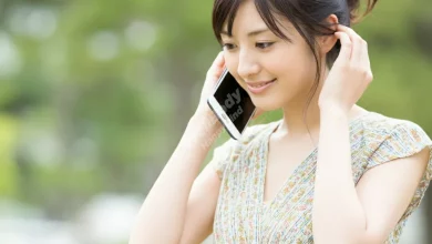 A person looking relaxed while putting away their smartphone