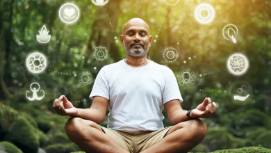 A person practicing mindfulness in a peaceful, natural setting, surrounded by elements representing positive psychology concepts