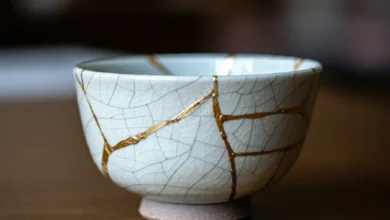 A beautifully repaired Kintsugi bowl with gold seams, symbolizing resilience and beauty in imperfection